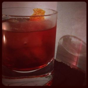 An image of the 1836 cocktail submitted by n0tquitethere that contains Anejo Tequila, Turin Bitters, Sweet Vermouth, Xocolatl Mole Bitters and Orange