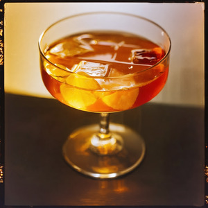 An image of the Dogfight cocktail submitted by Toby that contains Bourbon, Amaro Nonino, Aperol, Orange Bitters and Lemon