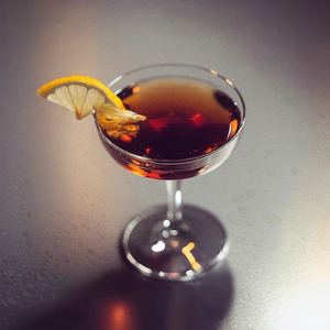 An image of the TNT cocktail submitted by Toby that contains Absinthe and Rye Whiskey