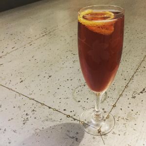 An image of the Alfonso cocktail submitted by n0tquitethere that contains Champagne, Dubonnet Rouge, Aromatic Bitters, Sugar and Lemon