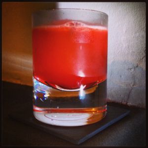 An image of the Antoine's Demise cocktail submitted by n0tquitethere that contains Peychauds Bitters, Passion Fruit Syrup, Lime and Allspice Dram