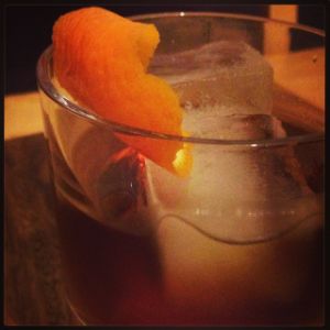 An image of the Ardent Spirit cocktail submitted by n0tquitethere that contains Gold Rum, Cynar, Sweet Vermouth and Orange