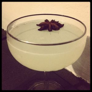 An image of the Blackstar cocktail submitted by n0tquitethere that contains Plain Vodka, Lime, Grapefruit, Ouzo, Simple Syrup and Star Anise
