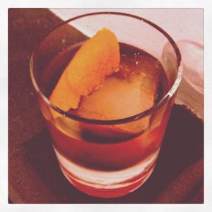 An image of the Campanilla cocktail submitted by n0tquitethere that contains Reposado Tequila, Turin Bitters, Cynar, Mezcal, Orange Bitters and Orange