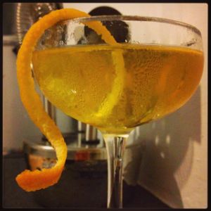 An image of the Caprice cocktail submitted by n0tquitethere that contains London Dry Gin, Dry Vermouth, Benedictine DOM, Orange Bitters and Orange