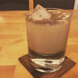An image of the Cereal Milk White Russian cocktail submitted by n0tquitethere that contains Plain Vodka, Coffee Liqueur, Cereal Milk and Coffee Beans