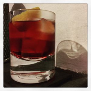 An image of the Chocolate Negroni cocktail submitted by n0tquitethere that contains London Dry Gin, Turin Bitters, Punt e Mes, Crème de Cacao Blanc and Orange