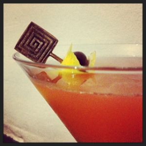 An image of the Cisco Bay cocktail submitted by n0tquitethere that contains London Dry Gin, Passion Fruit Syrup, Turin Bitters, Lemon, Grapefruit, Cocktail Cherry and Grapefruit