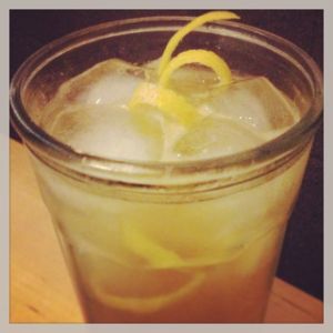 An image of the The Copywriter cocktail submitted by n0tquitethere that contains Irish Whiskey, Lemon, Sweet Vermouth, Honey Syrup, Soda Water and Lemon