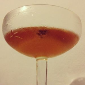 An image of the Crepuscule cocktail submitted by n0tquitethere that contains Cognac, Dry Vermouth, Raspberry Syrup, Orange Bitters and Bob's Bitters Abbott's Bitter