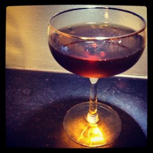 An image of the Crescent cocktail submitted by n0tquitethere that contains Amer Picon, Sweet Vermouth, Bourbon and Raspberry Syrup