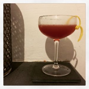 An image of the Crux cocktail submitted by n0tquitethere that contains Cognac, Curaçao Triple Sec, Dubonnet Rouge, Lemon and Lemon