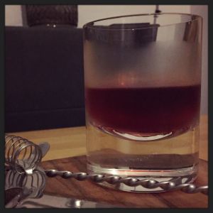 An image of the Dubonnet Tequila cocktail submitted by n0tquitethere that contains Reposado Tequila, Dubonnet Rouge, Drambuie, Xocolatl Mole Bitters and Orange