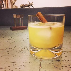 An image of the Enchanted Orchard cocktail submitted by n0tquitethere that contains Pisco, Apple Brandy, Benedictine DOM, Pineapple Juice, Lemon, Honey Syrup and Cinnamon