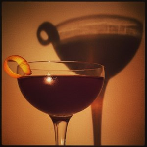 An image of the Fall Back cocktail submitted by n0tquitethere that contains Rye Whiskey, Apple Brandy, Amaro Nonino, Sweet Vermouth, Peychauds Bitters and Orange