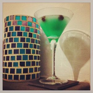 An image of the Frosty Windshield cocktail submitted by n0tquitethere that contains Plain Vodka, Crème de Cacao Blanc, Crème de Menthe and Cranberries