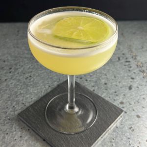 An image of the Gilda Cocktail cocktail submitted by n0tquitethere that contains Blanco Tequila, Pineapple Juice, Lime, Cinnamon Syrup and Lime