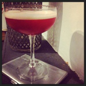 An image of the Giuseppe's Lady cocktail submitted by n0tquitethere that contains Gin, Cynar, Grenadine, Lime, Angostura Bitters and Lemon