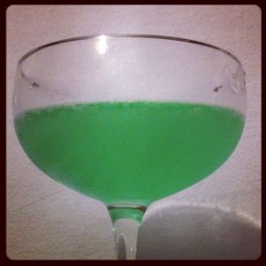 An image of the Green Dragon cocktail submitted by n0tquitethere that contains Lemon, Kümmel, Crème de Menthe, London Dry Gin and Peach Bitters