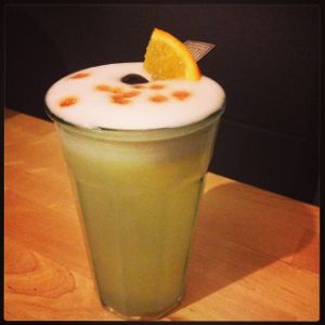 An image of the Gringo Pisco Sour cocktail submitted by n0tquitethere that contains Pisco, Simple Syrup, Lemon, Orange, Egg, Angostura Bitters, Orange and Cocktail Cherry