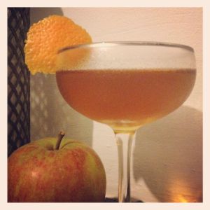 An image of the Harvest Moon cocktail submitted by n0tquitethere that contains Rye Whiskey, Lillet Blanc, Apple Brandy, Green Chartreuse, Bob's Bitters Abbott's Bitter and Orange