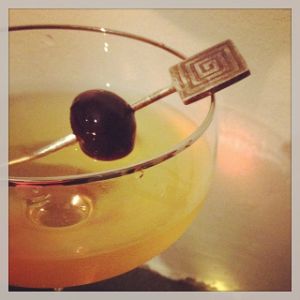 An image of the Inspiration cocktail submitted by n0tquitethere that contains London Dry Gin, Dry Vermouth, Apple Brandy, Grand Marnier and Cocktail Cherry