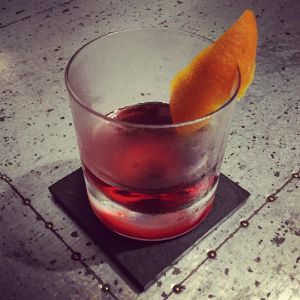 An image of the Kingston Negroni cocktail submitted by n0tquitethere that contains Smith & Cross, Sweet Vermouth, Turin Bitters and Orange