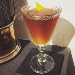 An image of the Lindsey's Whimsy cocktail submitted by n0tquitethere that contains Olorosso Sherry, Dry Vermouth, Amaro Montenegro, Benedictine DOM, Allspice Dram, Angostura Bitters and Lemon