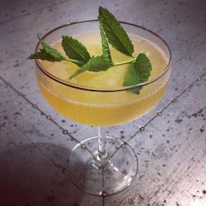 An image of the Little Secrets cocktail submitted by n0tquitethere that contains St Germain, Gold Rum, Gold Rum, Lime, Rhubarb Bitters and Mint