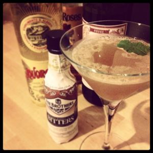An image of the Lock and Key cocktail submitted by n0tquitethere that contains Bourbon, Strega, Sweet Vermouth, Lemon, Whiskey Barrel Aged Bitters and Mint