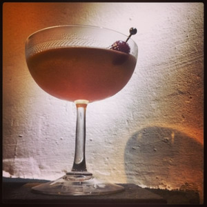 An image of the Made Man cocktail submitted by Toby that contains Rye Whiskey, Cherry Heering, Yellow Chartreuse, Fernet Branca and Cocktail Cherry