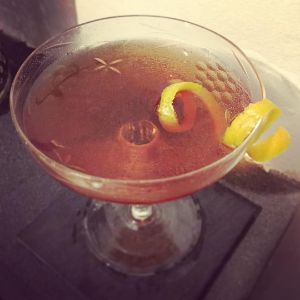 An image of the Marblehead cocktail submitted by n0tquitethere that contains London Dry Gin, Sweet Vermouth, Crème de Cassis, Orange Bitters and Orange