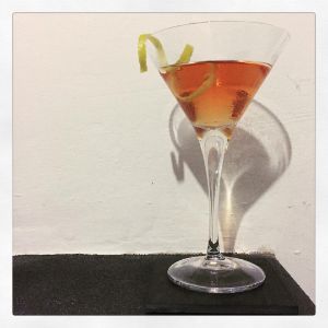 An image of the Merry Widow cocktail submitted by n0tquitethere that contains London Dry Gin, Dry Vermouth, Angostura Bitters, Benedictine DOM, Absinthe and Lemon