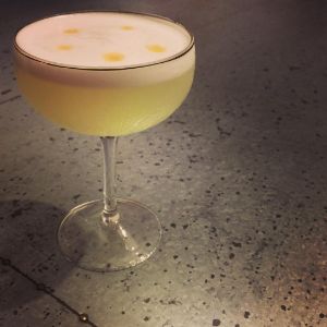 An image of the Mezcal Sour cocktail submitted by n0tquitethere that contains Mezcal, Lemon, Simple Syrup, Egg and Bitters