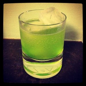 An image of the Midori Spumoni cocktail submitted by n0tquitethere that contains Midori Melon Liqueur, Grapefruit and Soda Water