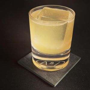 An image of the Moment in the Sun cocktail submitted by n0tquitethere that contains Applejack, Mezcal, Lemon and Honey Syrup