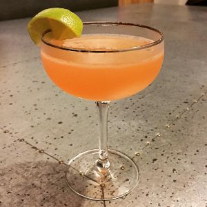 An image of the Nevada Cocktail cocktail submitted by n0tquitethere that contains White Rum, Grapefruit, Lime, Simple Syrup, Angostura Bitters and Lime