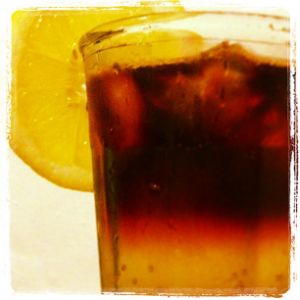 An image of the New Yorker cocktail submitted by n0tquitethere that contains Rye Whiskey, Lemon, Simple Syrup, Soda Water, Lemon and Dry Red Wine