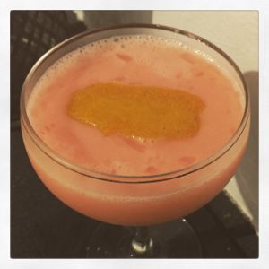 An image of the Petticoat Junction cocktail submitted by n0tquitethere that contains London Dry Gin, Aperol, Lemon, Orgeat Syrup, Grapefruit Bitters, Cherry Bitters and Lemon