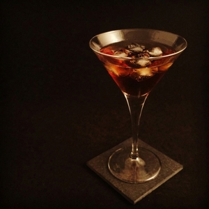 An image of the Porn Star Martini cocktail submitted by Toby that contains Passion Fruit, Vanilla Vodka, Vanilla Syrup, Lime and Passoa