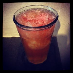 An image of the Red Maple Swizzle cocktail submitted by n0tquitethere that contains Gold Rum, Lemon, Maple Syrup and Peychauds Bitters
