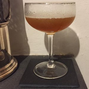 An image of the Skyrocket Cocktail cocktail submitted by n0tquitethere that contains Rye Whiskey, Sweet Vermouth, Swedish Flaggpunsch, Aromatic Bitters and Lemon