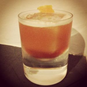 An image of the Some Like It Hot cocktail submitted by n0tquitethere that contains Rye Whiskey, Aperol, Yellow Chartreuse, Orange, Whiskey Barrel Aged Bitters, Hot Sauce and Orange