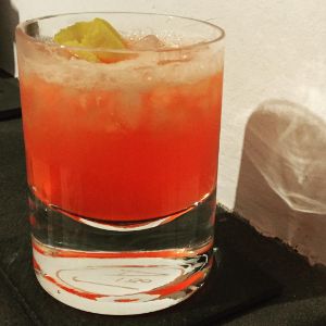 An image of the Sophia Loren Shim cocktail submitted by n0tquitethere that contains Aperol, Lemon, Bourbon, Rhubarb Bitters and Lemon