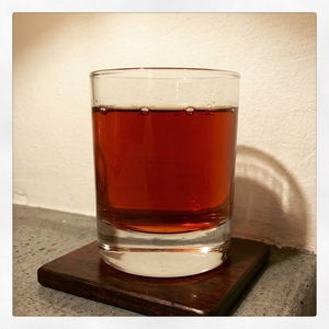 An image of the The Charlatan cocktail submitted by Toby that contains Punt e Mes, Turin Bitters, Cherry Brandy, Orange Bitters and Orange