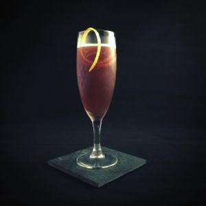 An image of the The Graduate cocktail submitted by n0tquitethere that contains Turin Bitters, Crème de Cassis, Lemon, Sparkling Wine and Orange