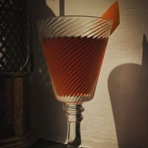 An image of the Trophy Room Cocktail cocktail submitted by n0tquitethere that contains Cognac, Bourbon, Cynar, Maraschino Liqueur, Angostura Bitters, Peychauds Bitters and Orange