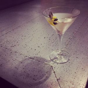 An image of the Tuxedo cocktail submitted by n0tquitethere that contains London Dry Gin, Dry Vermouth, Maraschino Liqueur, Orange Bitters, Absinthe, Lemon and Cocktail Cherry