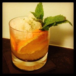 An image of the Whiskey Smash cocktail submitted by n0tquitethere that contains Orange, Mint, Mint Syrup, Rye Whiskey and Mint