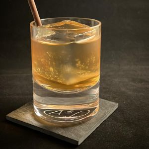 An image of the White Chocolate Sazerac cocktail submitted by n0tquitethere that contains Armagnac, Bourbon, Crème de Cacao Blanc, Gomme Syrup and Chocolate Pencil